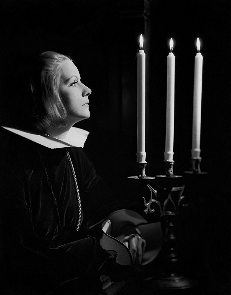 Clarence Sinclair Bull :: Candles for a Queen / Three Candles. Swedish born actress Greta Garbo in costume for her role in the film ’Queen Christina’, directed by Rouben Mamoulian, 25th October 1933 (Getty Images) | src IMdB