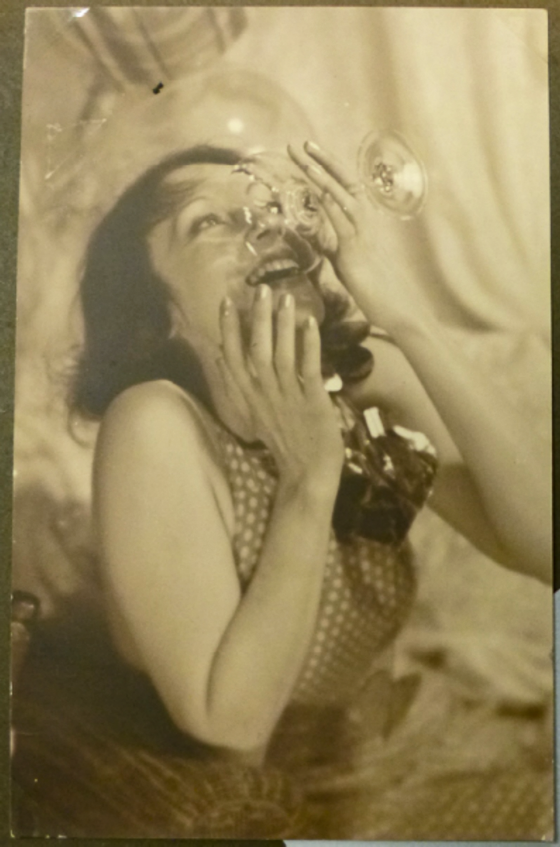 Franz Fiedler :: A young woman (Olga Irén Fröhlich) holding a champagne glass in her right hand, the rim touching her lips. Dresden, ca. 1925-1932. On verso: (purple stamp): "phot. Franz Fiedler, Dresden-A., Sedanstr. 7". | src Jüdisches Museum Berlin