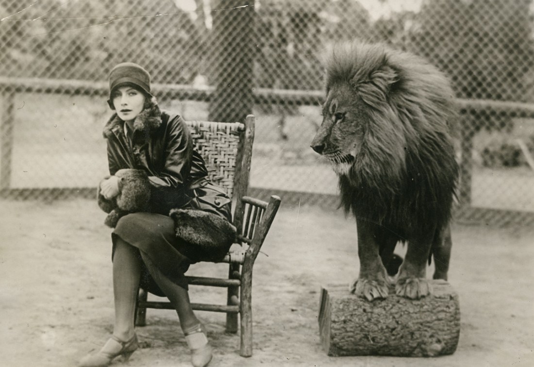 MGM lion and Greta Garbo in a cage, 1920s