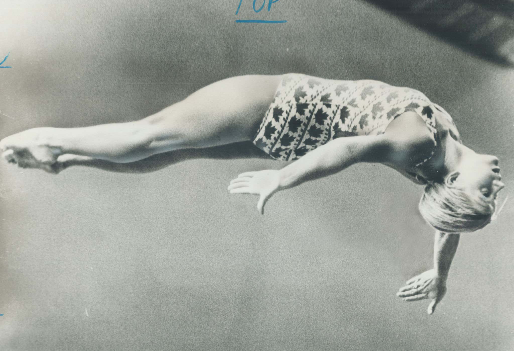 Ron Bull :: Cindy Shatto dips her head into a downturn in the final of Olympic platform diving. Canada, July 25th, 1976. | src Getty Images